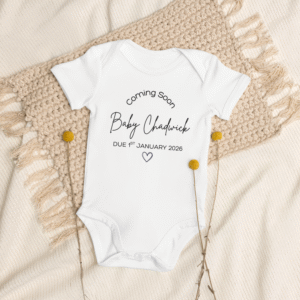 Personalised baby onesie with name and heart design for announcement