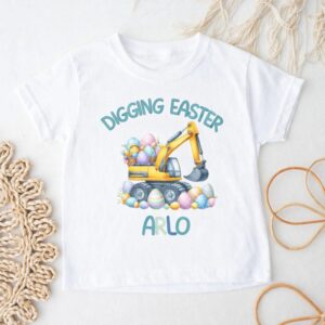 Little boy wearing personalised digging Easter digger T-shirt with blue name text