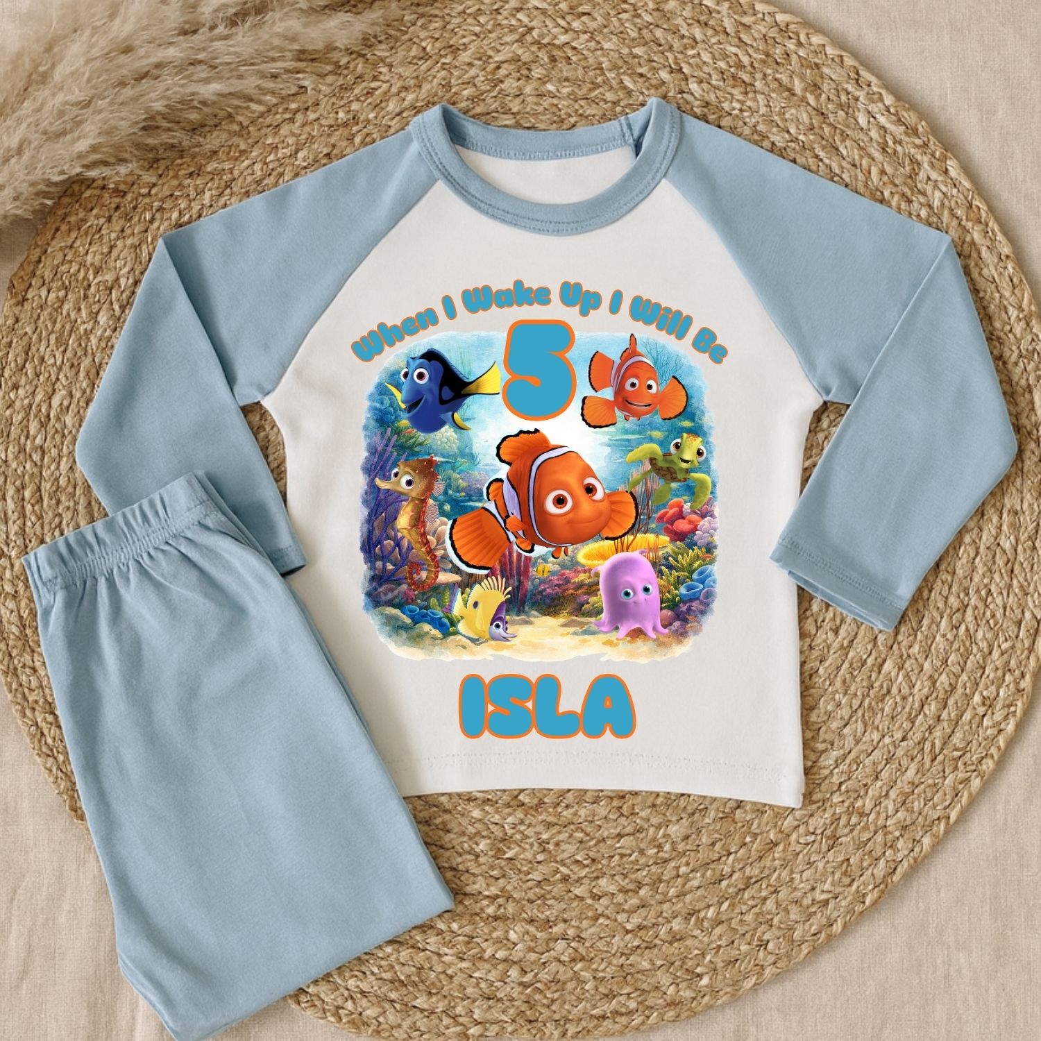 Under the Sea Birthday Pyjamas Blue Stripe Close up of personalised under the sea birthday pyjamas with striped sleeves