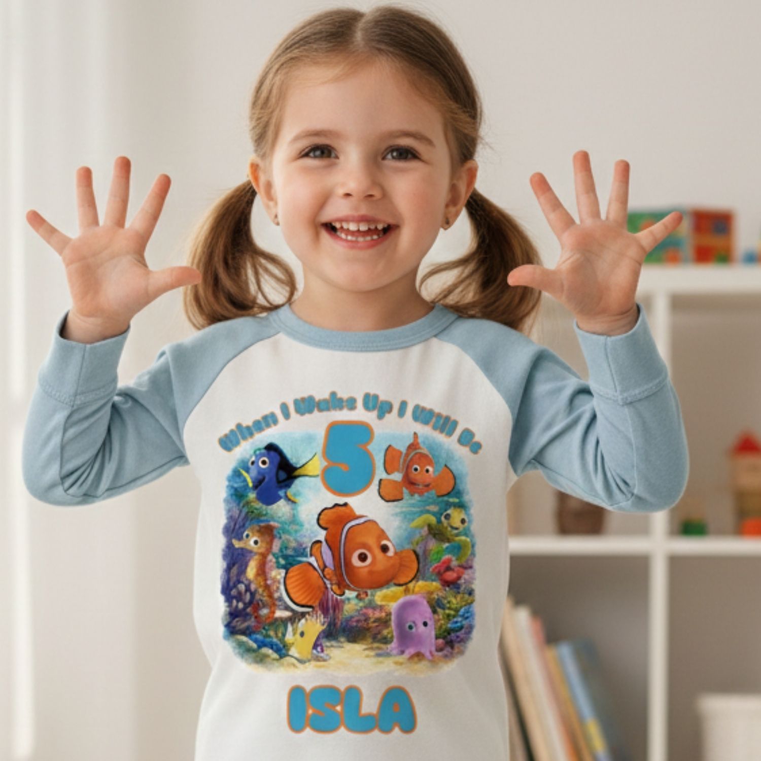Kids Wearing Under the Sea Birthday Pyjamas Child wearing personalised under the sea birthday pyjamas on birthday morning