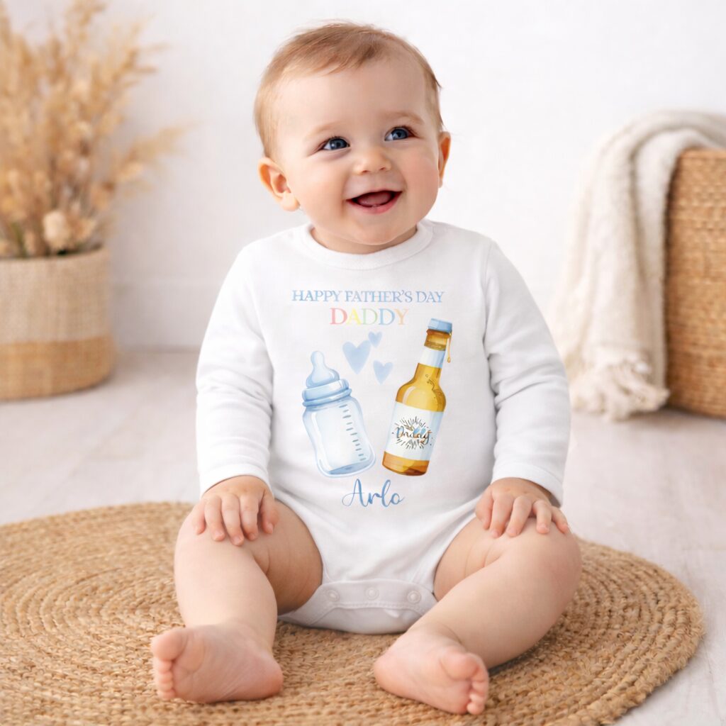 Baby wearing personalised first Father’s Day baby grow with daddy design blue