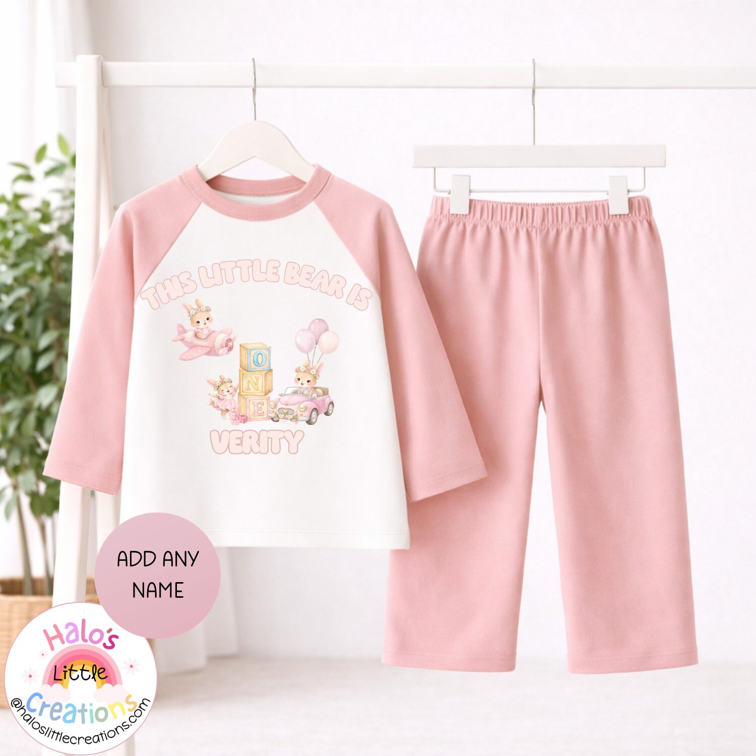 Plain pink girls first birthday pyjamas with personalised teddy bear design