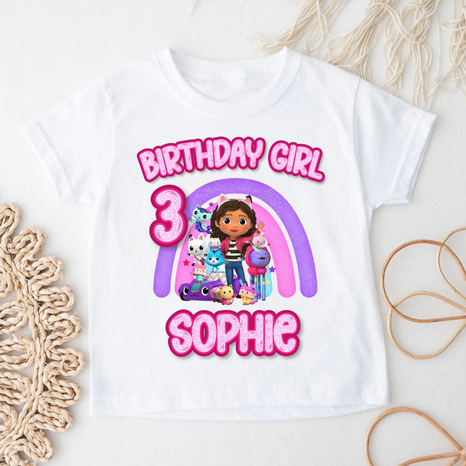 Custom Gabby's Dollhouse birthday girl shirt with personalised name and age displayed with children's clothing