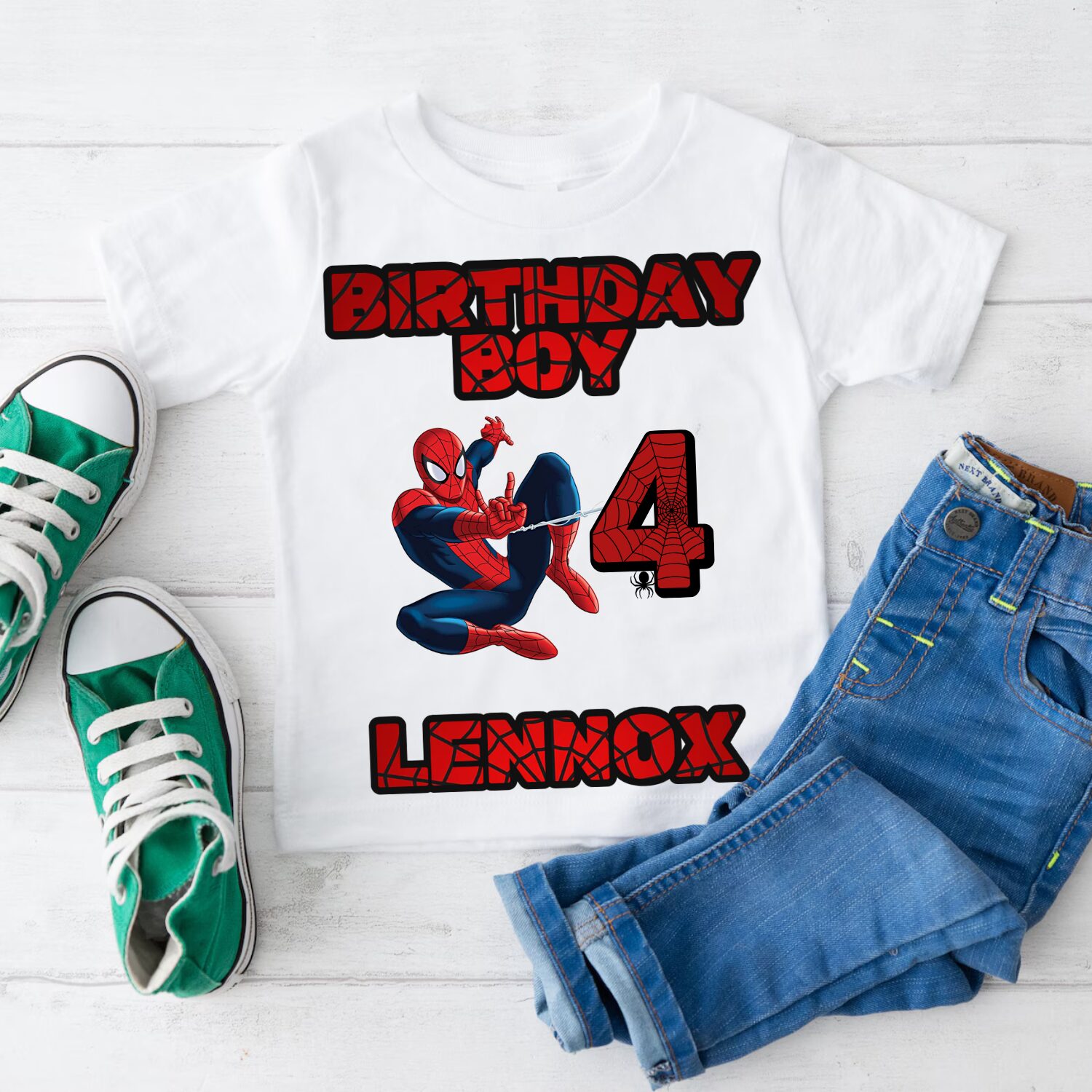 Flat lay superhero birthday t-shirt for boys with personalised name and age