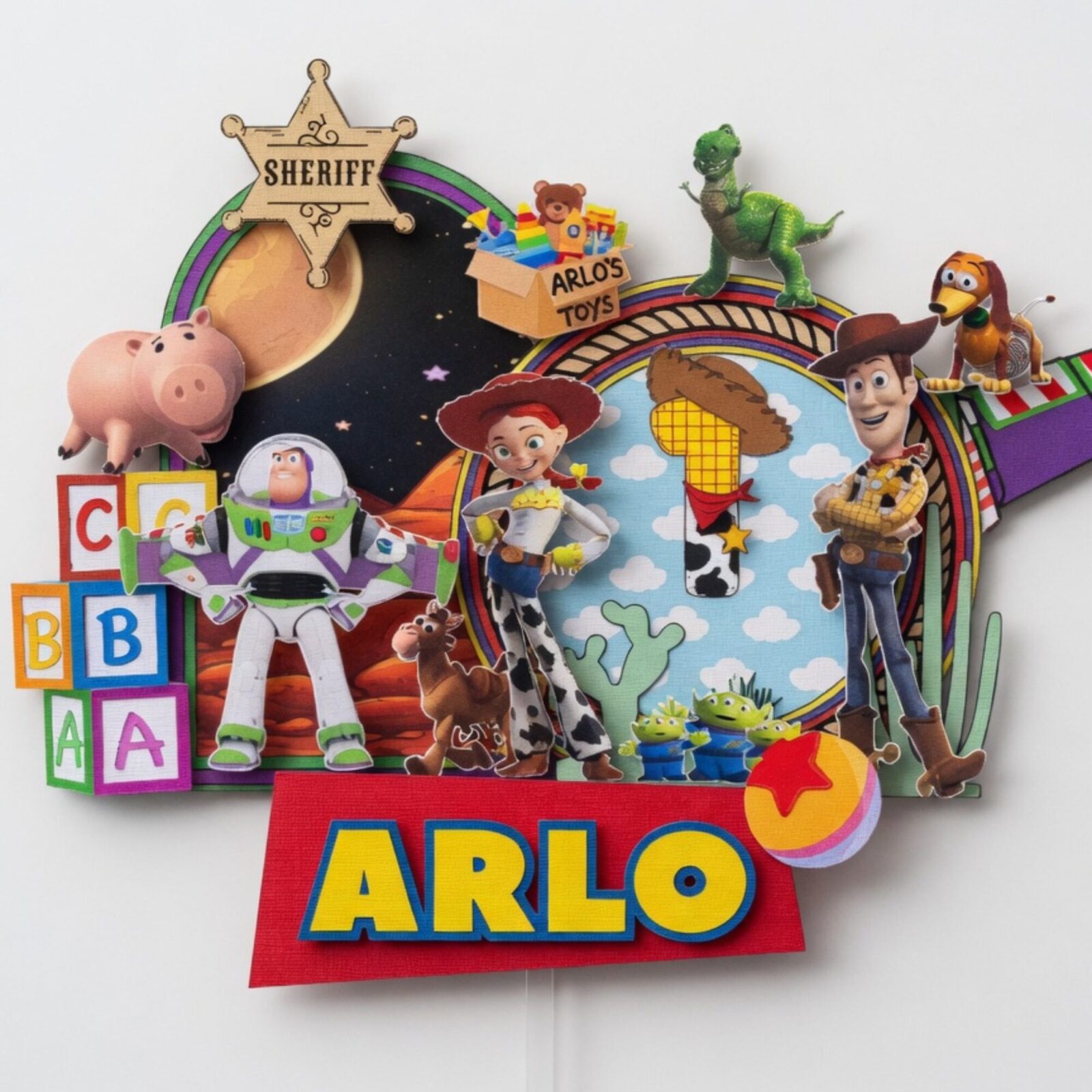 personalised toy story cake topper – custom name & age birthday cake decoration Personalised Toy Story cake topper with custom name Arlo and age 1 featuring colourful toy themed birthday characters