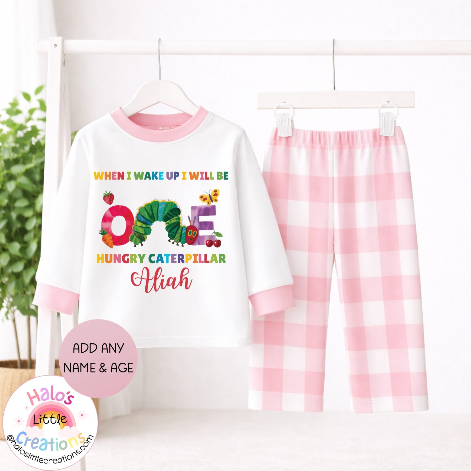 Pink gingham personalised first birthday pyjamas with caterpillar design