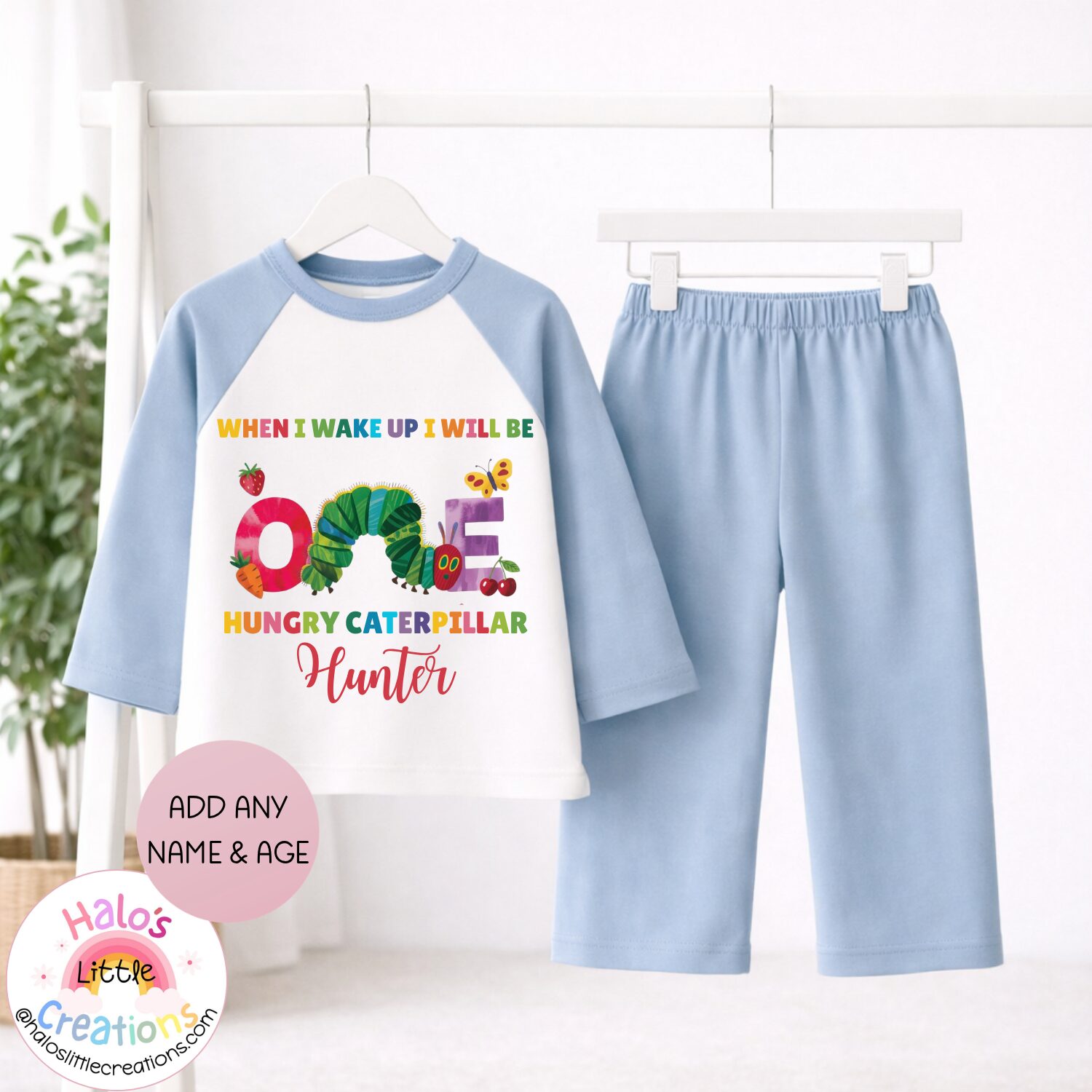 Plain blue personalised first birthday pyjama set with Hungry Caterpillar theme