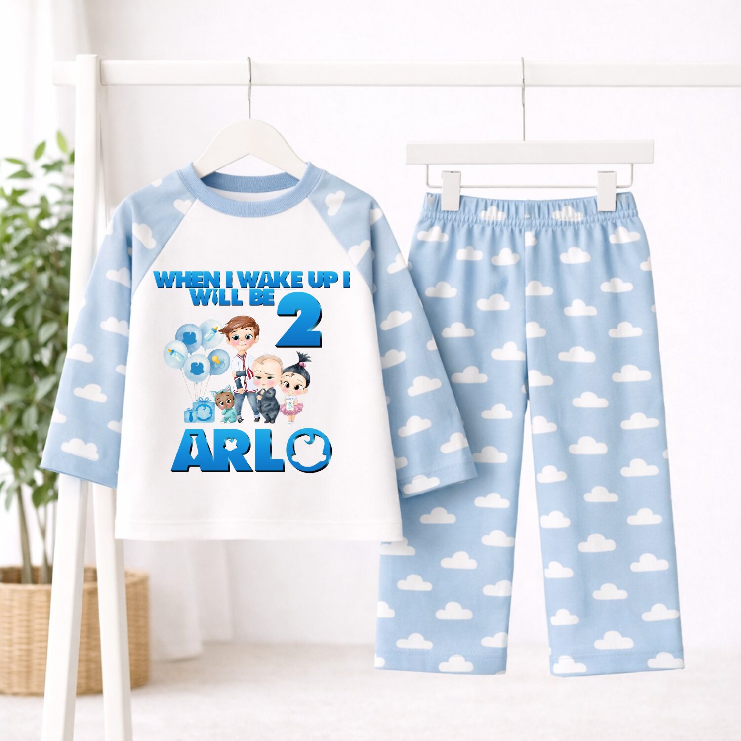 Personalised Boss Baby birthday pyjamas with blue cloud print sleeves and trousers customised with child's name and age