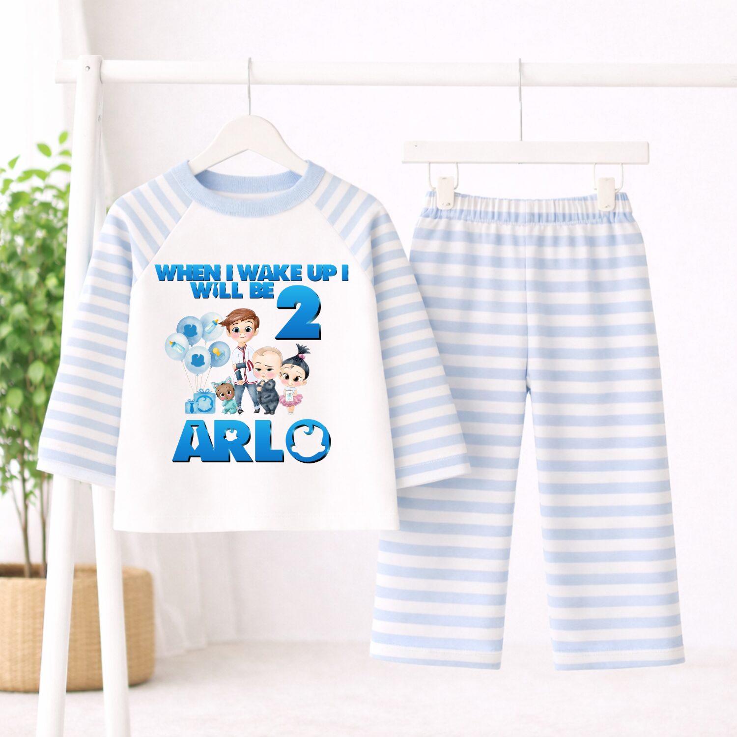 Personalised Boss Baby birthday pyjamas with blue striped sleeves and trousers customised with child's name and age