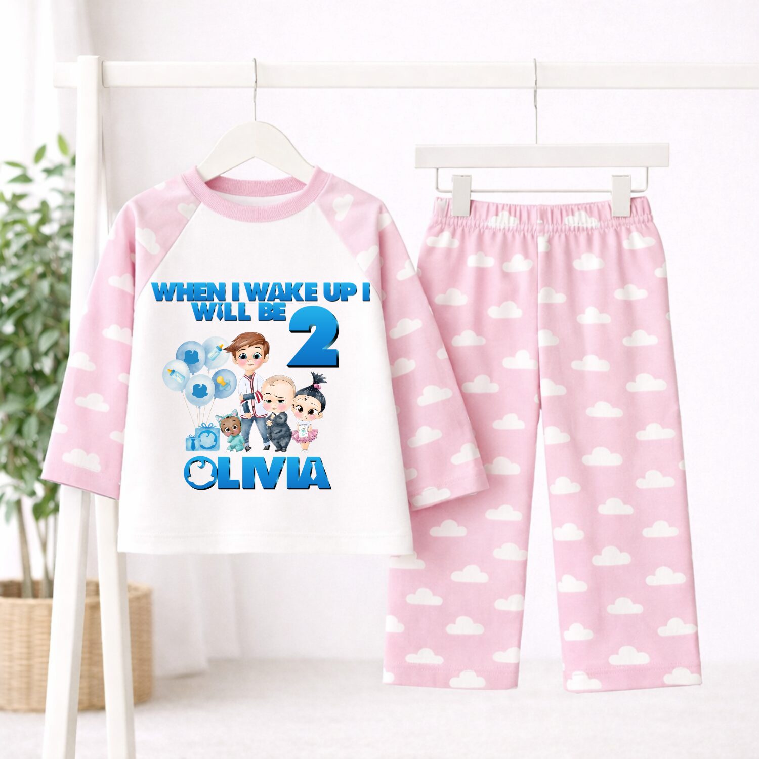 Personalised Boss Baby birthday pyjamas with pink cloud print sleeves and trousers customised with child's name and age