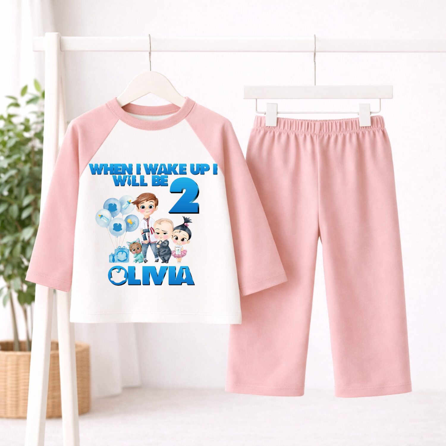 Personalised Boss Baby birthday pyjamas with plain pink sleeves and trousers customised with child's name and age