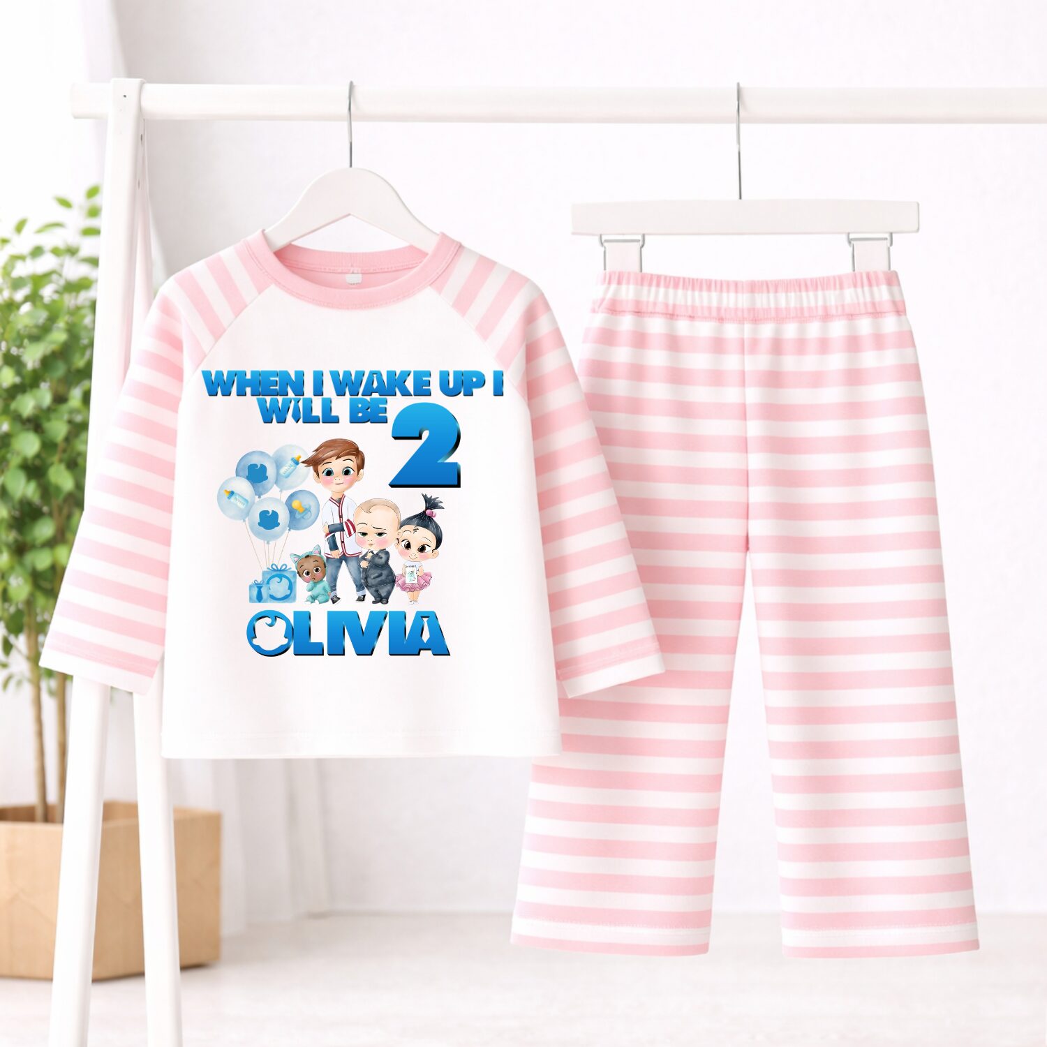 Personalised Boss Baby birthday pyjamas with pink striped sleeves and trousers customised with child's name and age