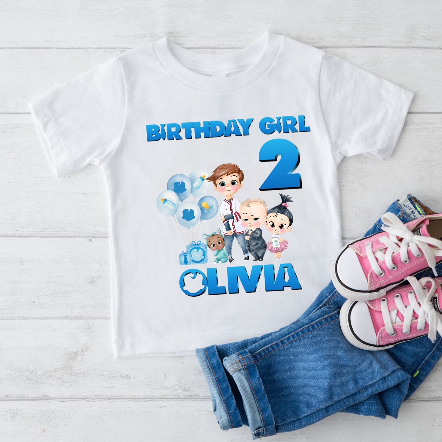 Toddler wearing personalised Boss Baby birthday boy t shirt with custom name Ronnie and age 1 during birthday celebration