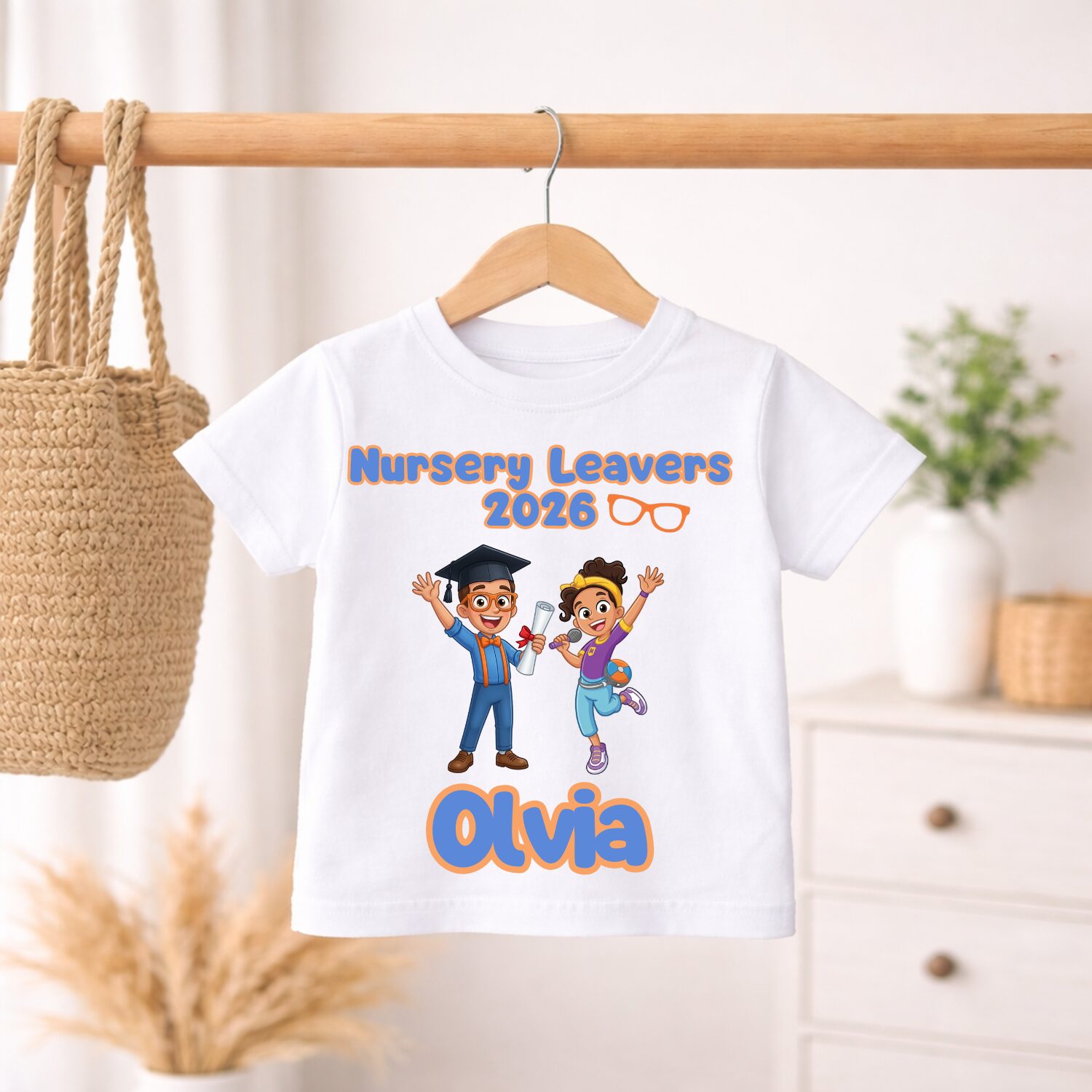 Personalised Nursery Leavers 2026 t-shirt hanging on wooden hanger featuring custom educational character inspired design