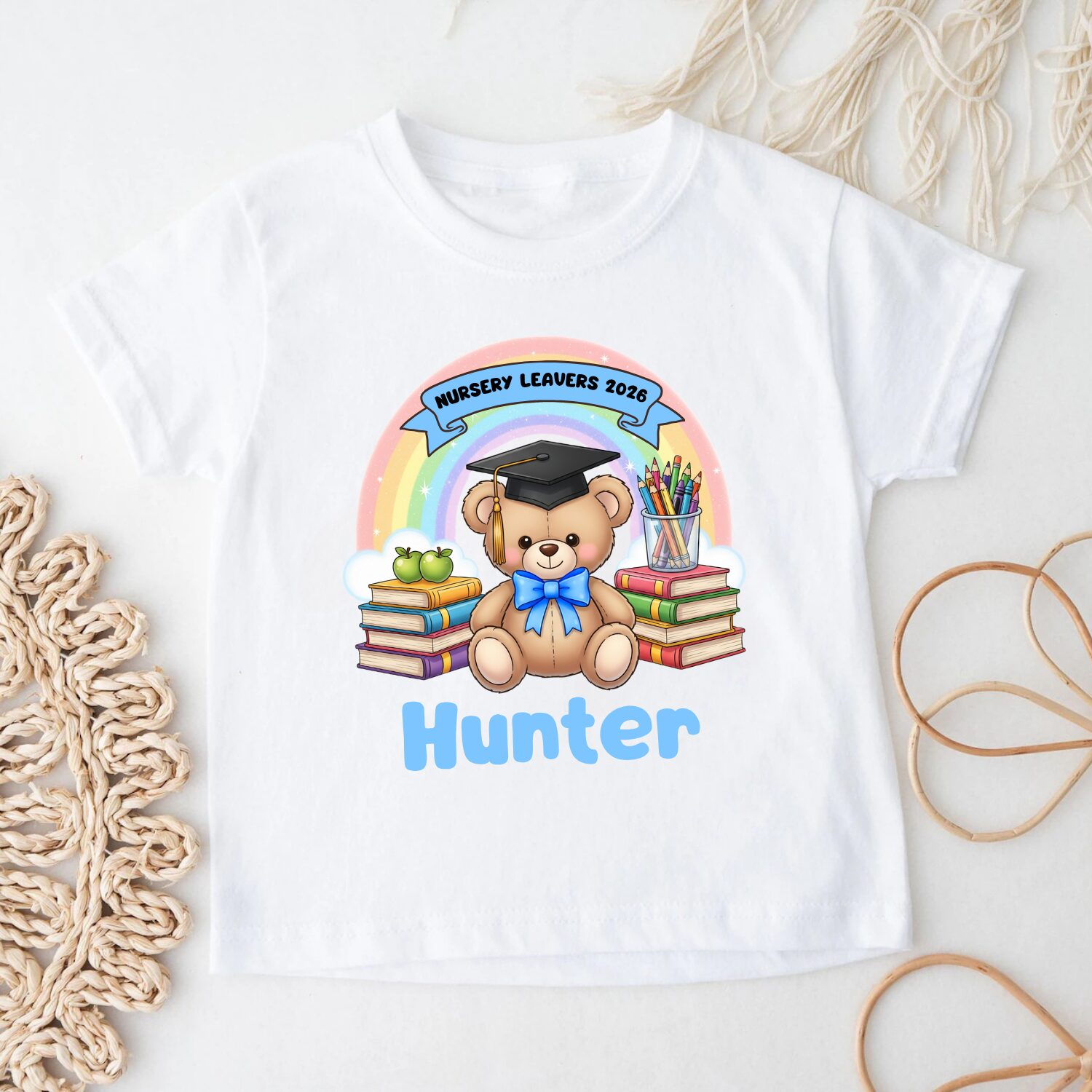 Personalised Nursery Leavers 2026 teddy bear rainbow t-shirt for girls displayed on hanger