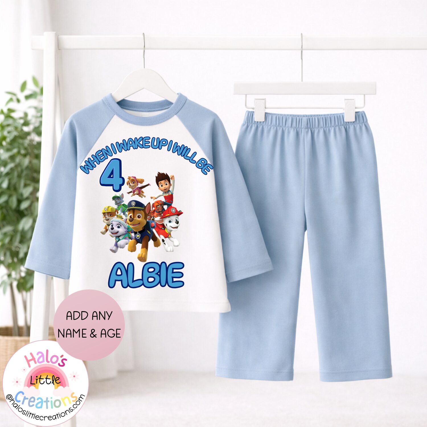 Personalised plain blue Paw Patrol birthday pyjamas with custom name and age for boys and girls.
