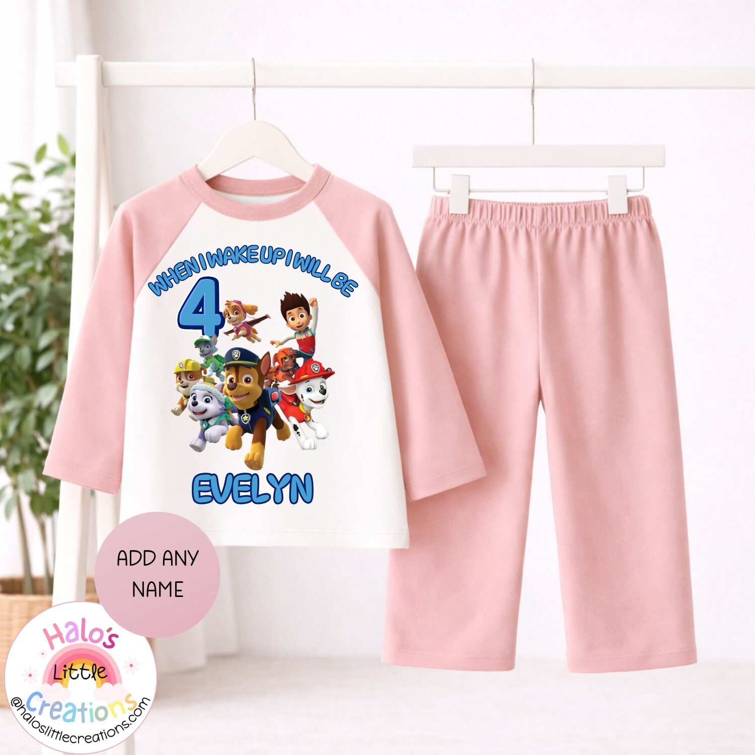 Personalised plain pink Paw Patrol birthday pyjamas with any name and age printed on the top.