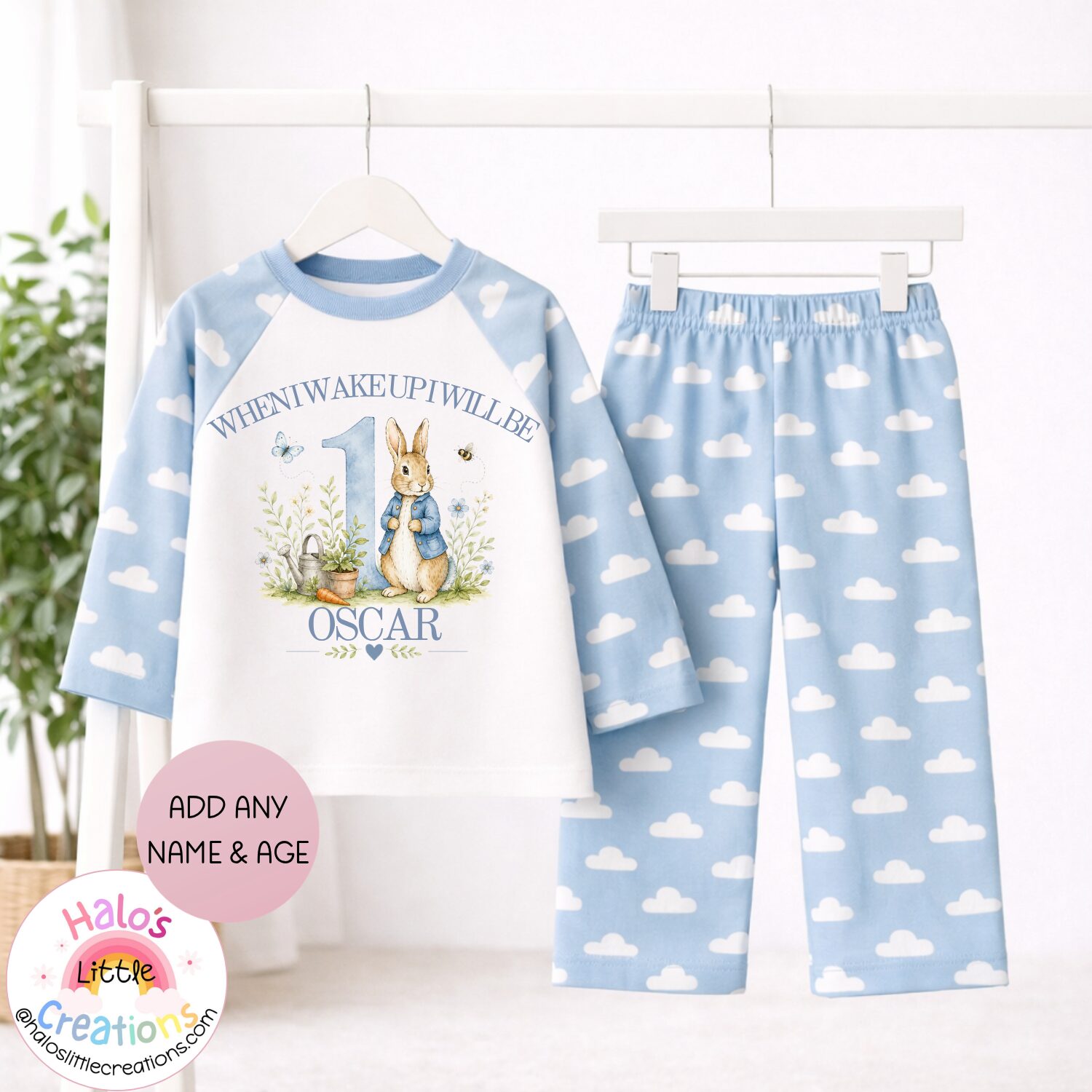 Personalised Peter Rabbit inspired birthday pyjamas with blue cloud print bottoms and custom name and age.