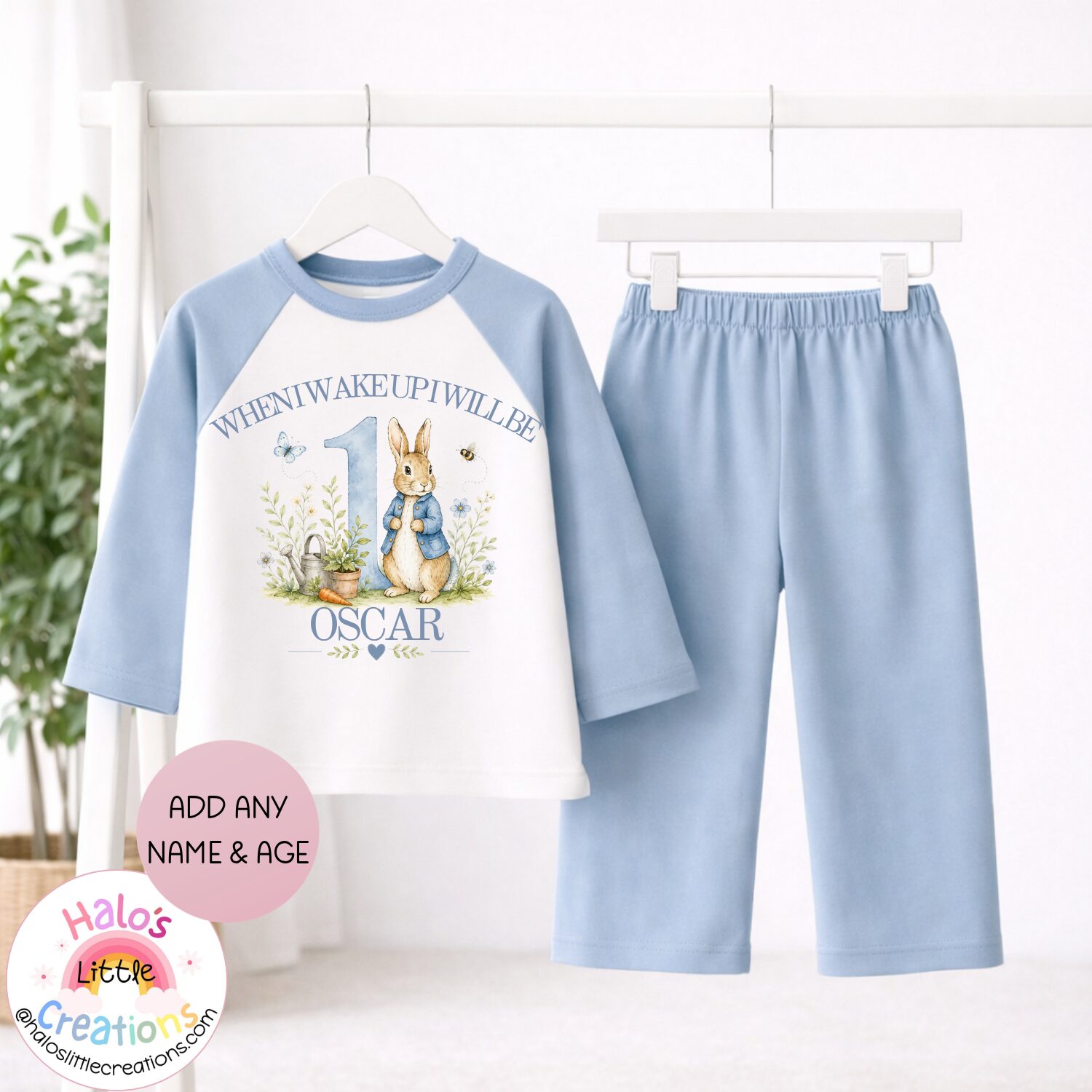 Personalised Peter Rabbit inspired birthday pyjamas with plain blue bottoms and custom birthday design.