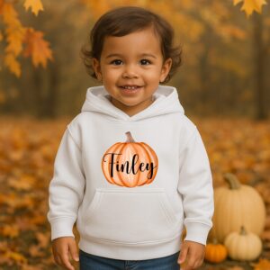 Child wearing personalised pumpkin hoodie for autumn and pumpkin picking